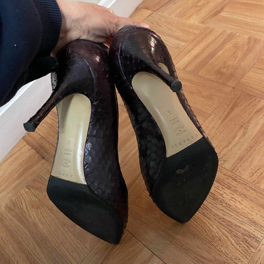 Dark purple, elegant heels.